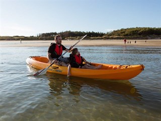 Kayaking in the sea by Silver Bay Holiday Village, Rhoscolyn