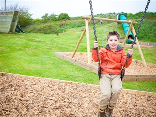 Outdoor play area at Silver Bay Holiday Village, Rhoscolyn